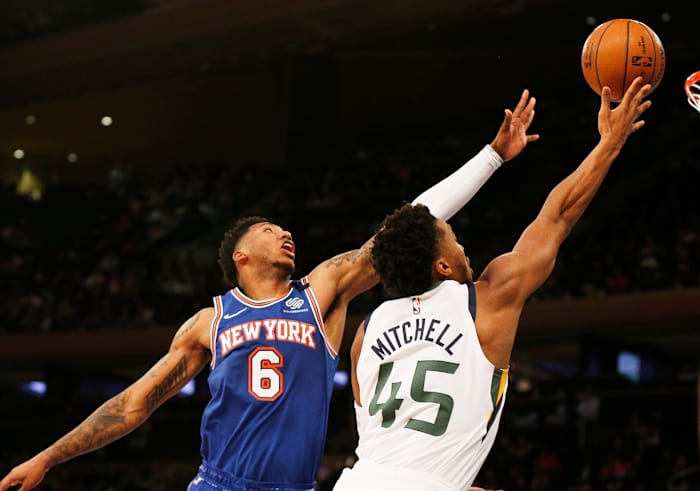 Jazz guard Donovan Mitchell (right) and Knicks guard Elfrid Payton (left) - photo by Andy Marlin